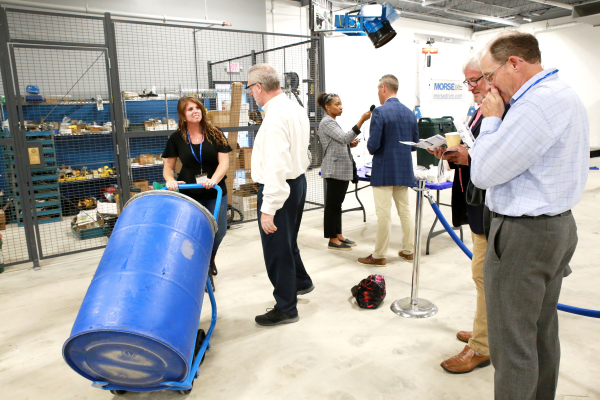 Morse open house - Visitor uses Morse drum truck