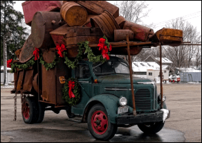 truck overloaded with drums