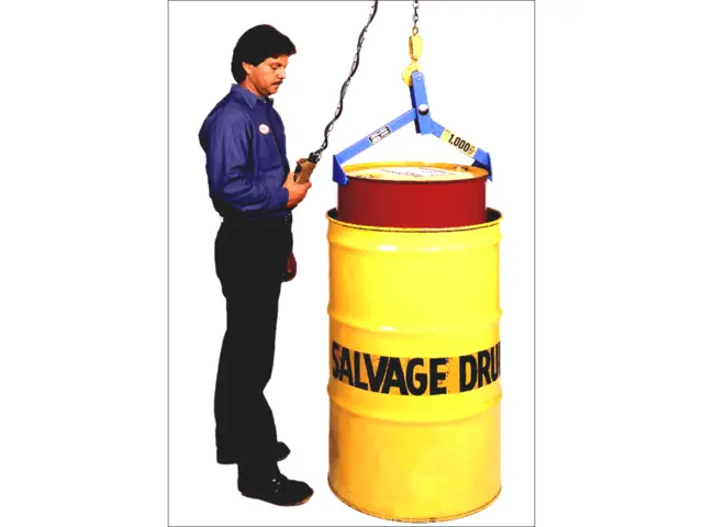 Model 91 Drum Lifter placing a 55-gallon (210 liter) steel drum into a salvage drum